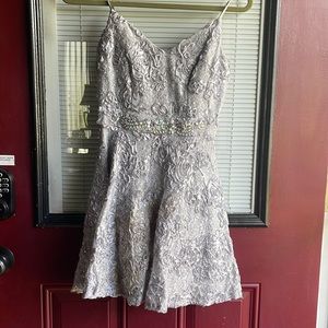 Silver homecoming dress runs more like a size 1/2